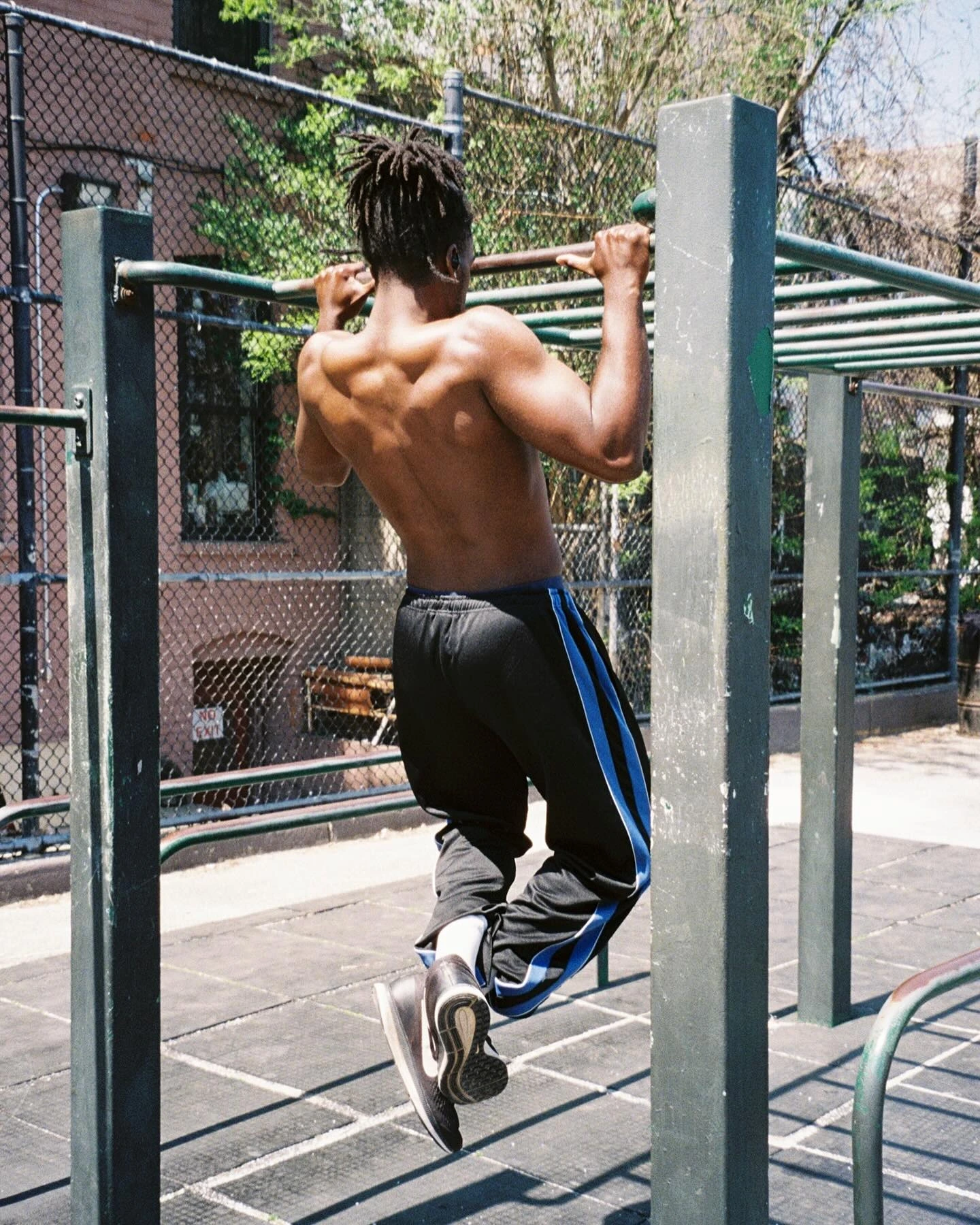 DK on an outdoor pull-up bar