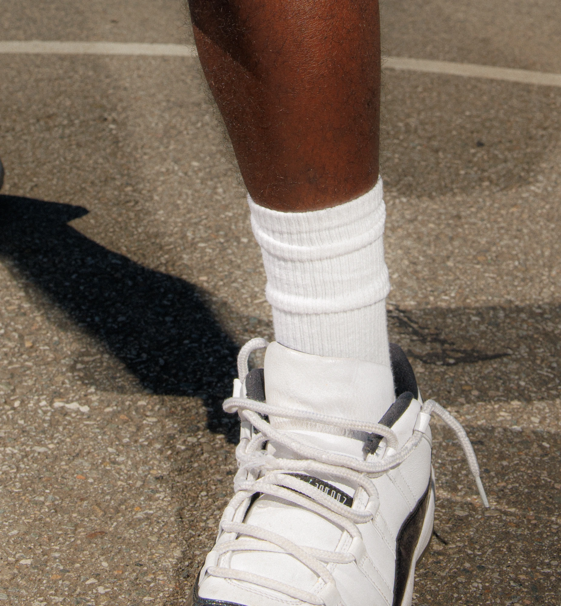 A sneaker on the painted court line