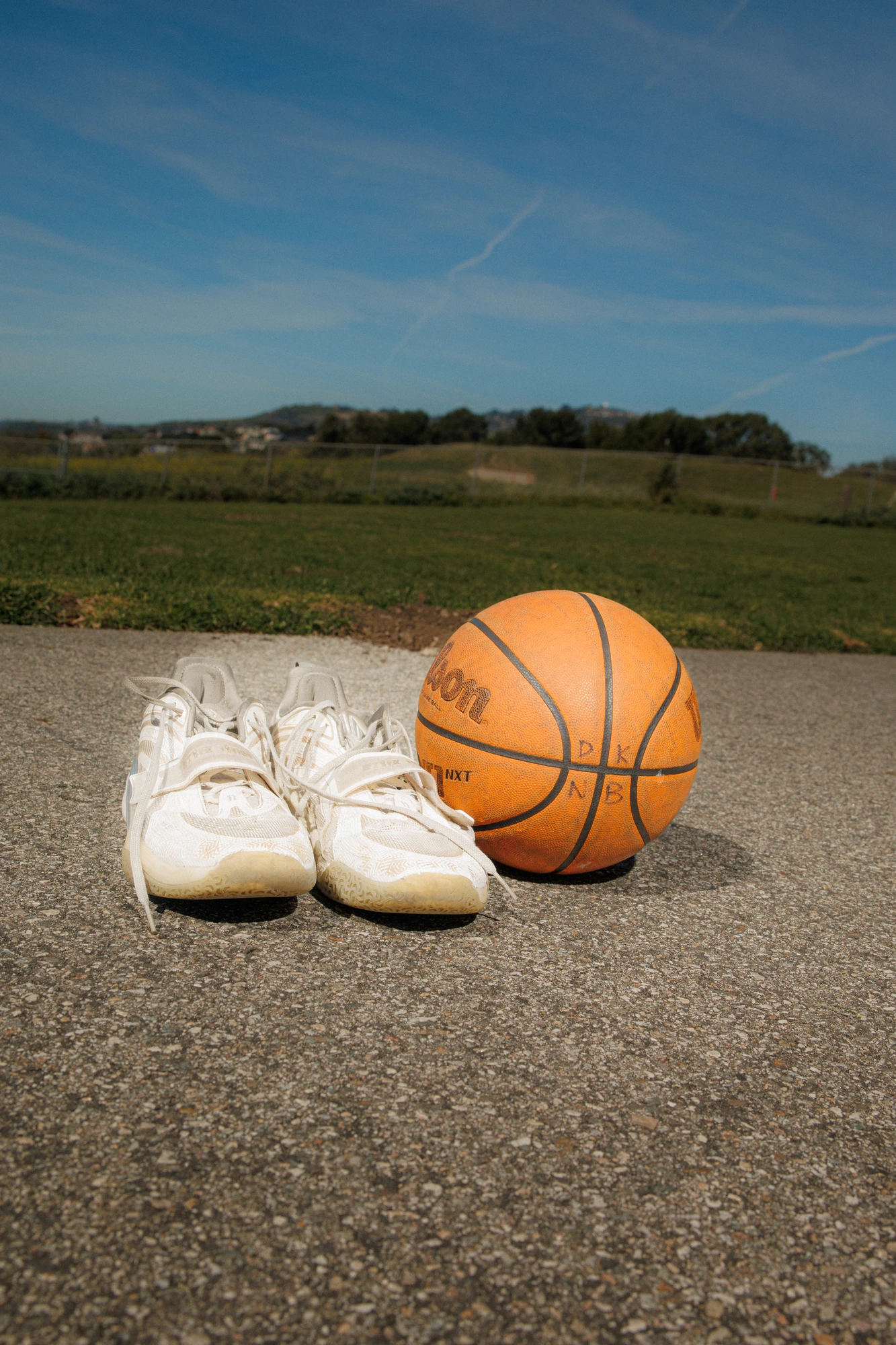 Sneakers and a basketball, wider
