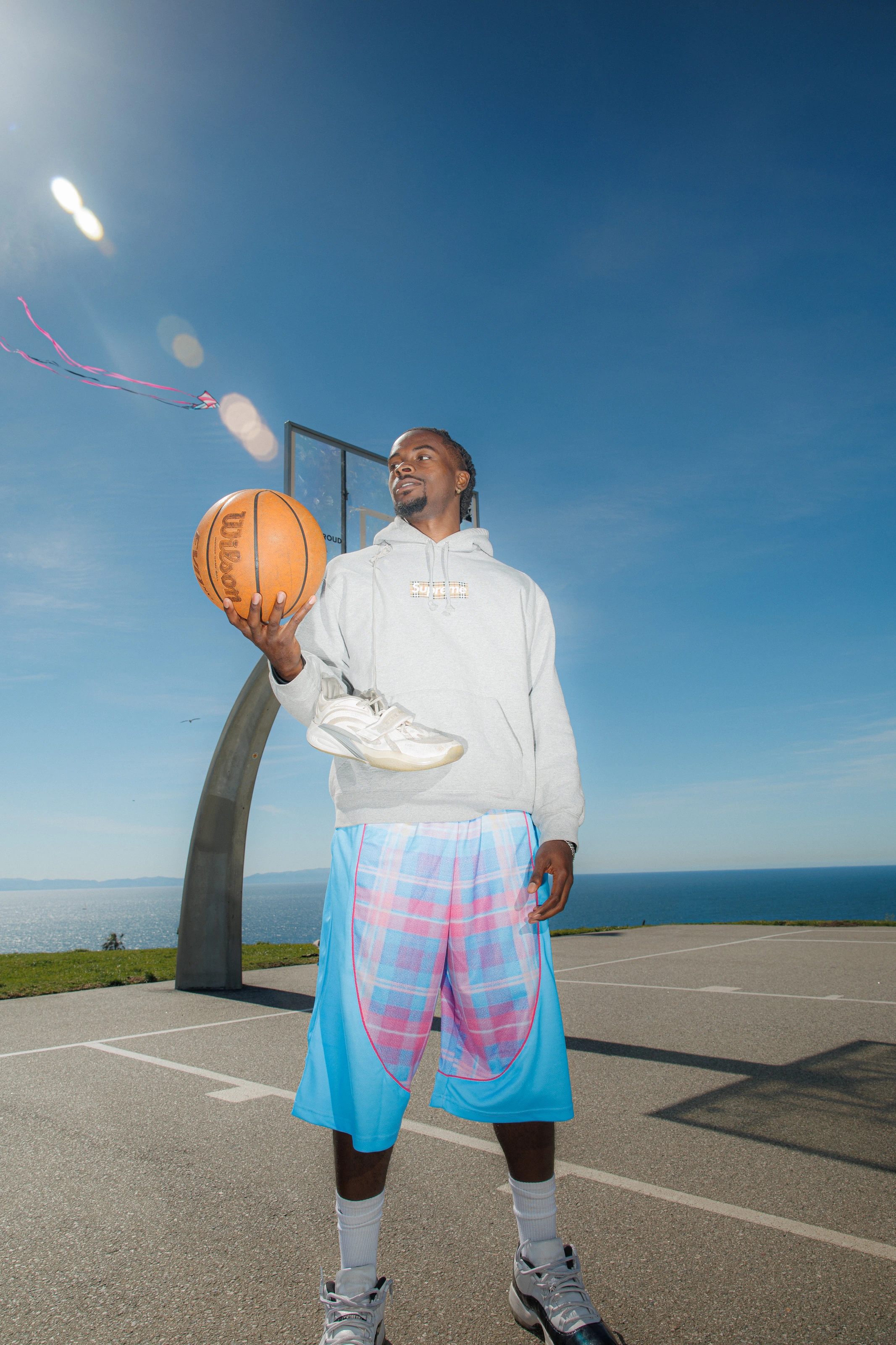 DK under the hoop holding the ball up