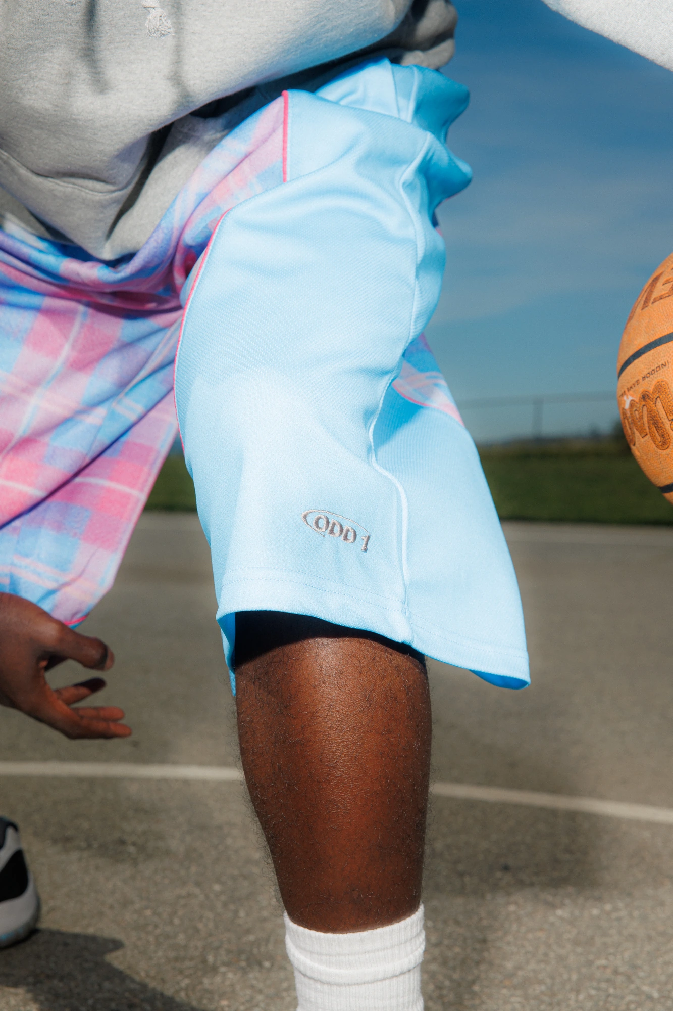 Plaid shorts and the ball, close