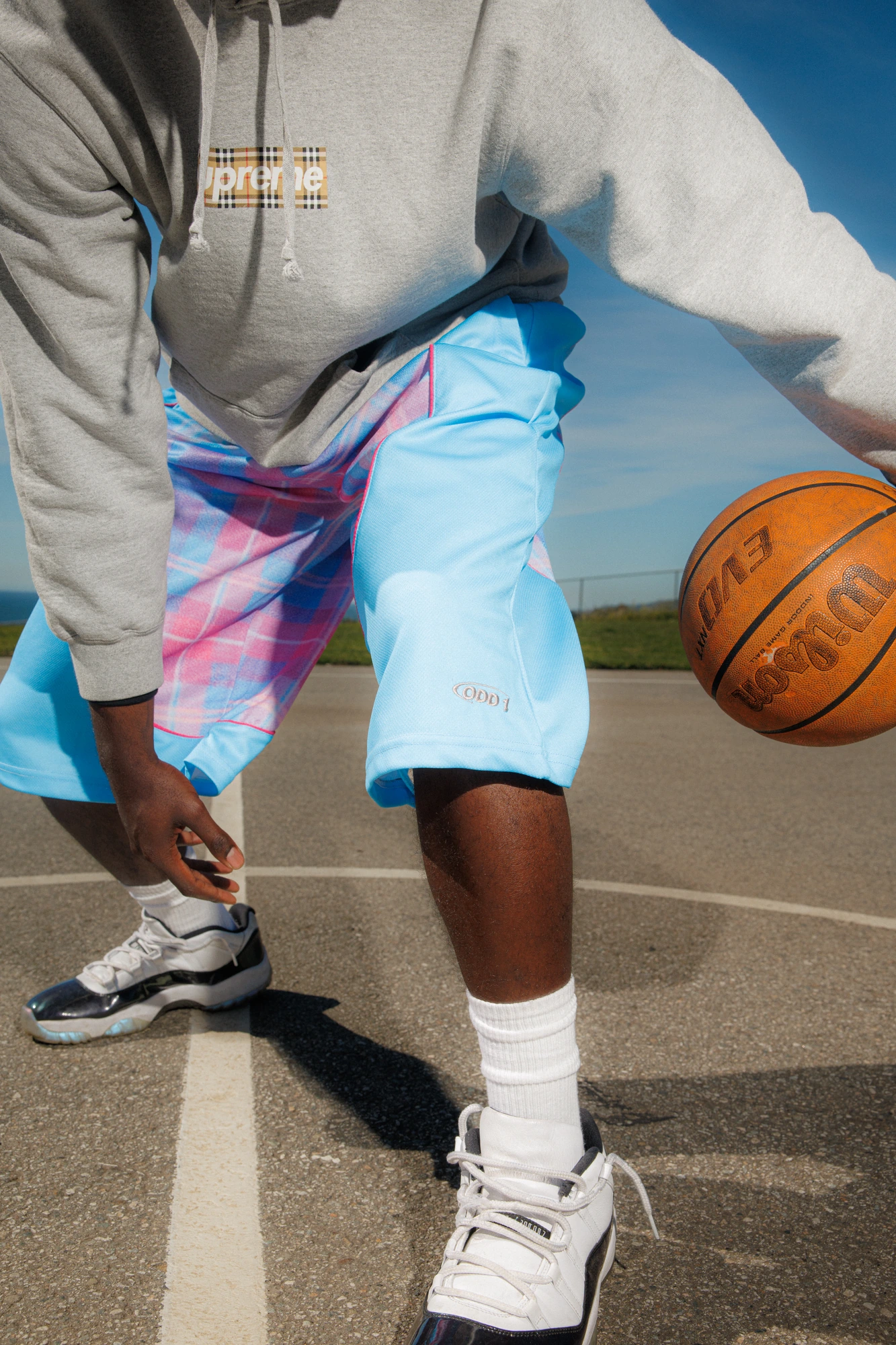 Sneakers and the court line, close