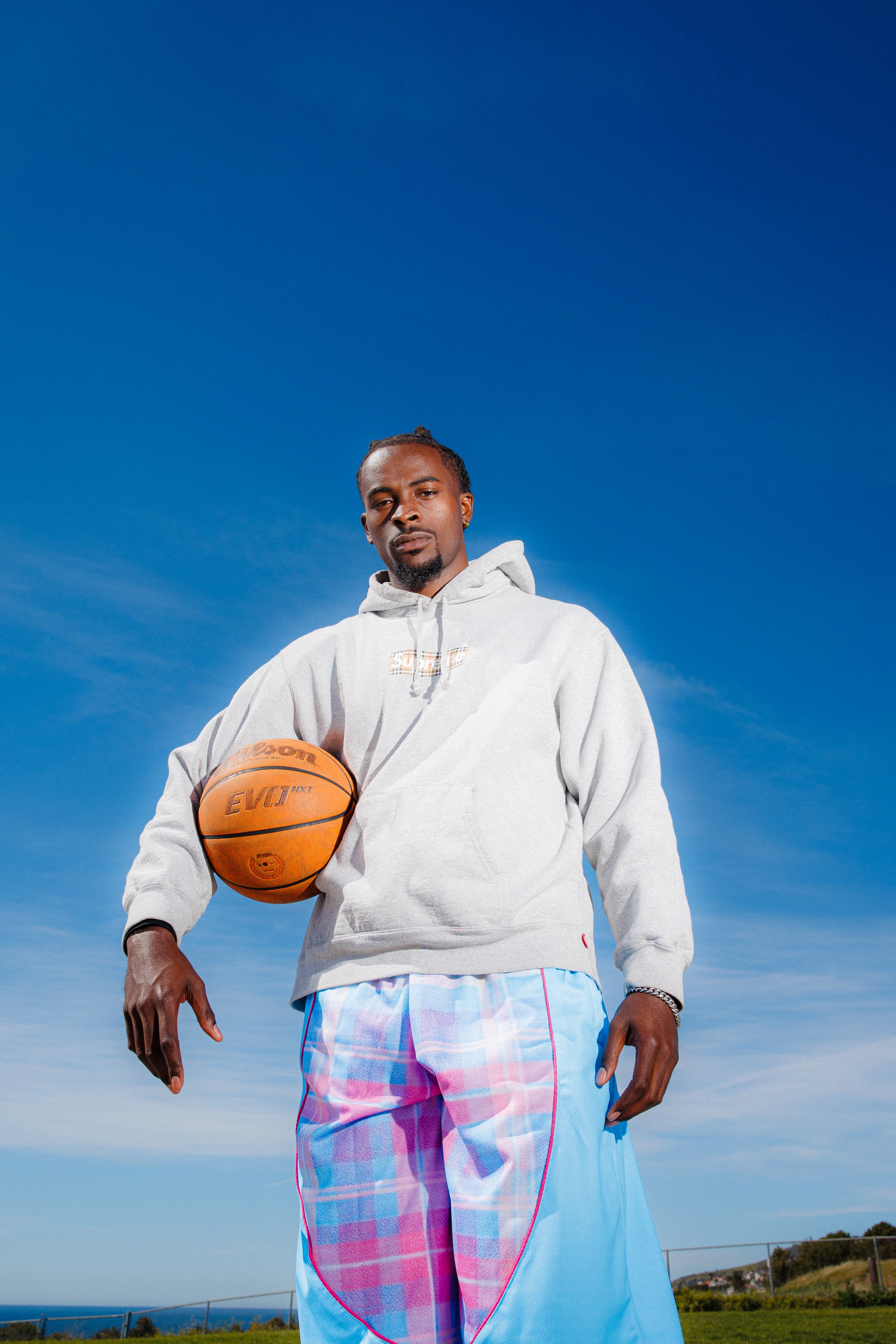 DK against open sky, ball at his hip