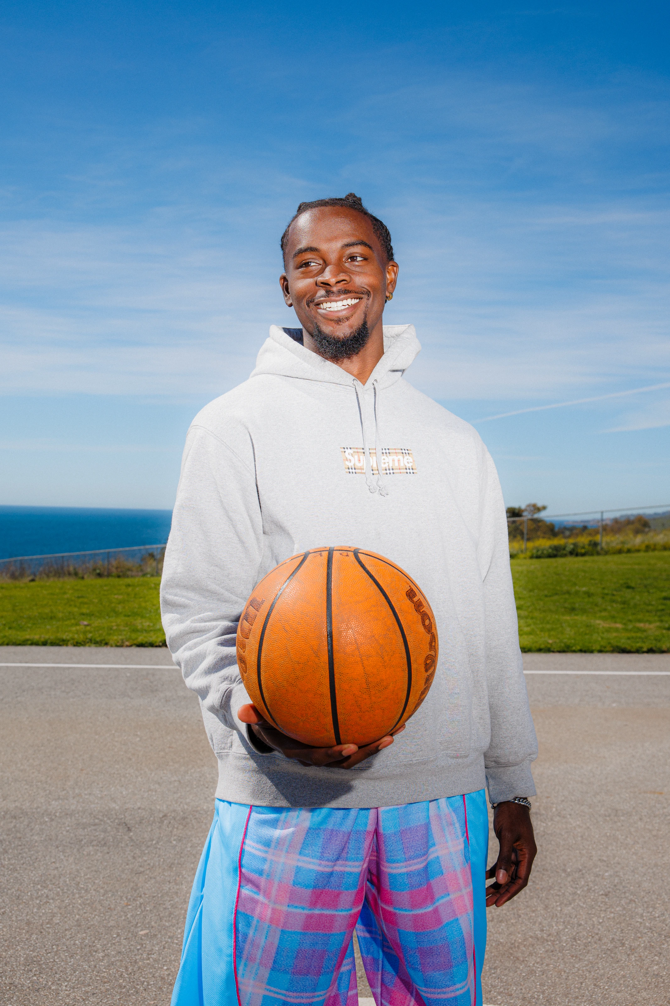 DK smiling, ball under his arm