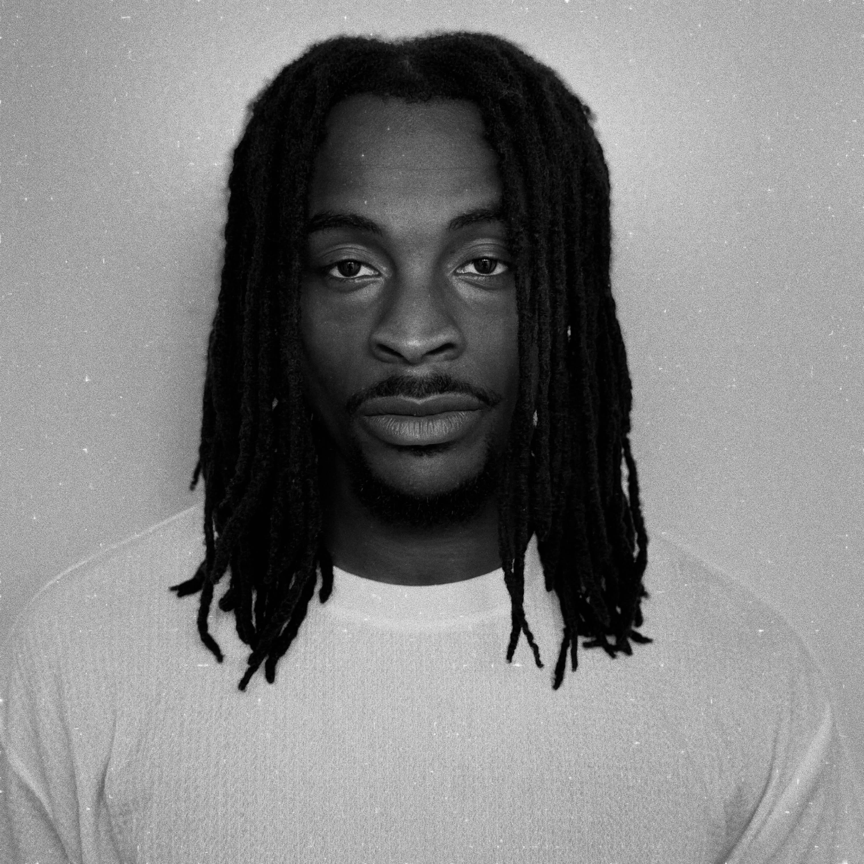 Black and white studio portrait, straight to camera