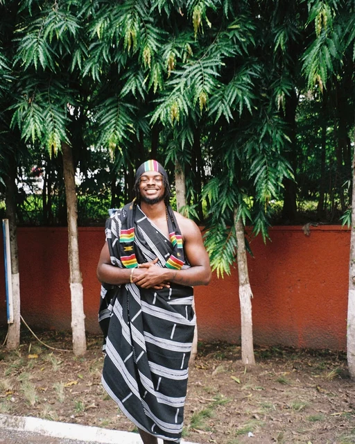 DK in a wrapped textile, standing